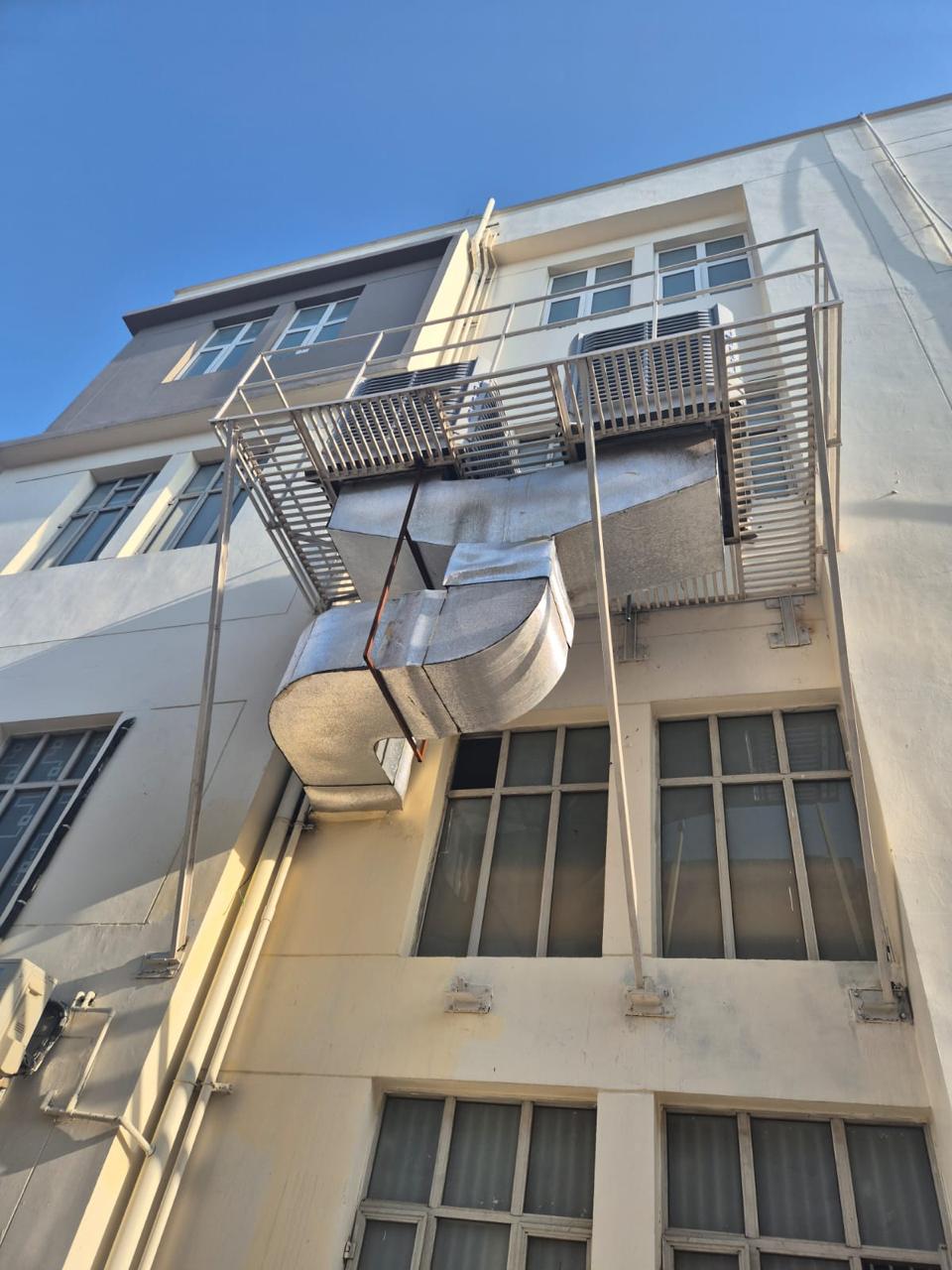 GI ducting and air distribution system installed on a multi-storey building facade