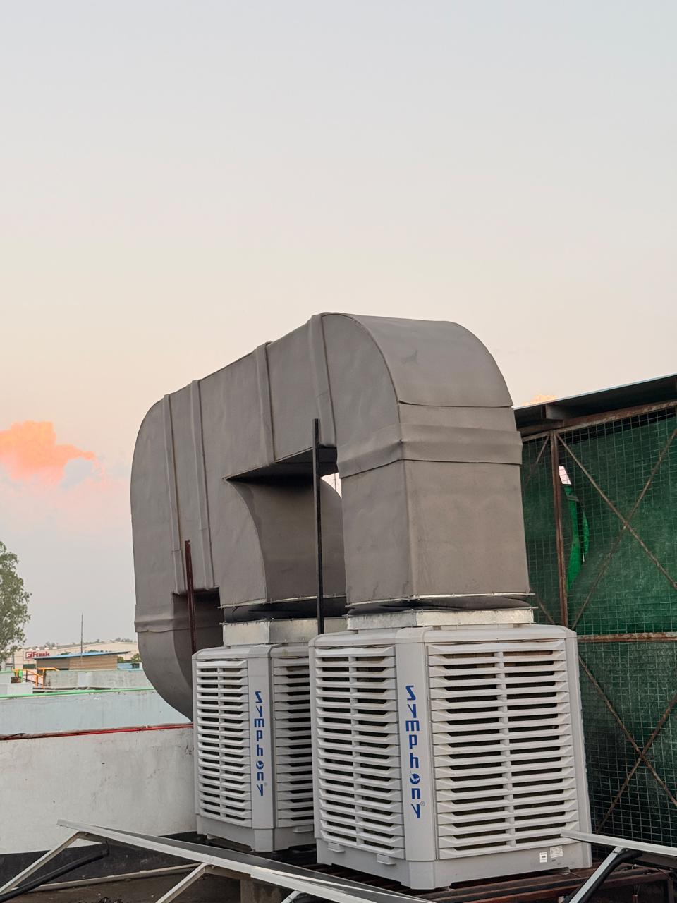 Twin Symphony industrial air coolers with GI ducting installed by MK Solutions on a rooftop
